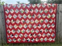 Red bordered feed sack quilt