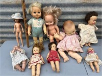 assortment of vintage dolls