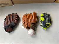 Three kids, baseball gloves, and ball