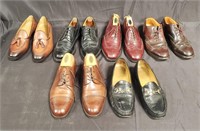 Group of men's designer style pairs of shoes