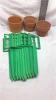 C7, three clay pots, and 11 garden markers