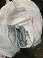 bag of white table clothes