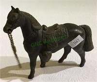Vintage metal horse measuring 4 1/2 inches tall.