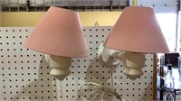 Matching wooden IKEA wall lamps with pink fabric