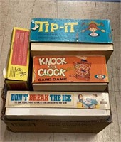 Box of vintage games includes Tip It, Knock the