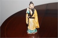Chinese mudman figurine possibly circa 1905-1920