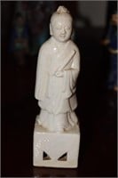 Chinese white glazed man figurine with tag that