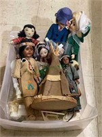 Great plastic box full of smaller dolls includes