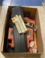 Box of Mattel dual Lane speedometer parts.