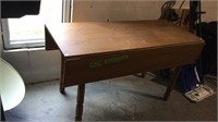 Pine drop leaf table measuring 54 inches long, 30