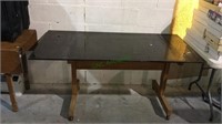 Vintage glass top table on wheels w/thick