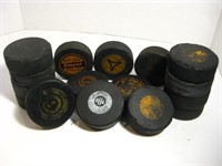 A COLLECTION OF VINTAGE HOCKEY PUCKS