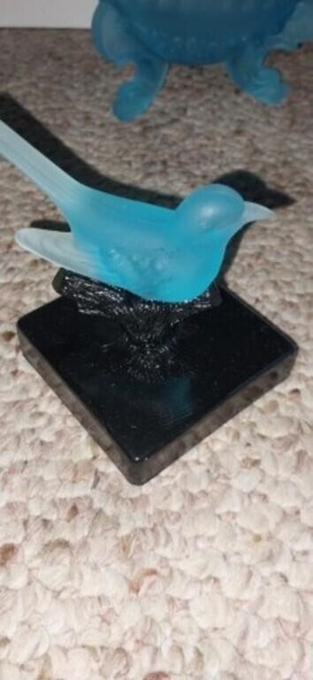 Blue glass bird on stand