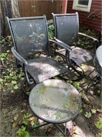 Two metal and fabric outdoor chairs with small