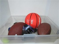 Box of Various outdoor sports equipment, Footballs