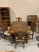 64" LONG ORNATELY CARVED WOOD DINING TABLE & 6
