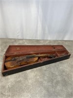 Antique violin with lions head and wood coffin box