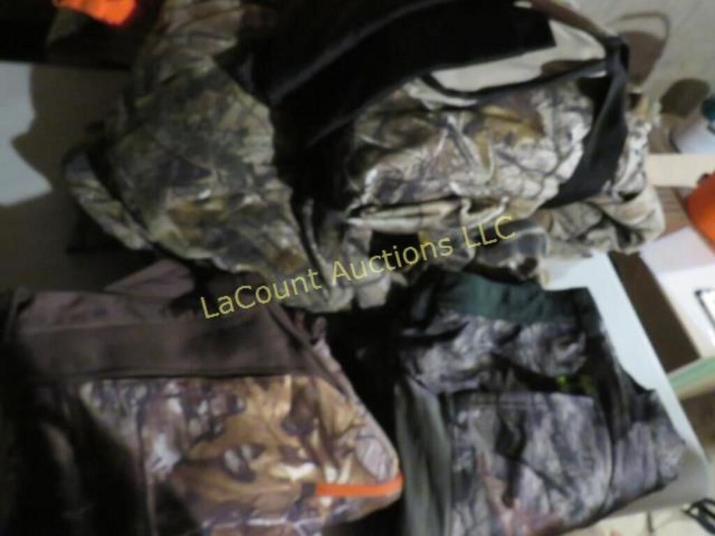assorted camo clothing under armor pants