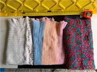 Three crocheted baby blankets