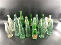 Collection of vintage mostly 7up bottles