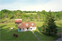 4 BEDROOM HOME ON 27+/- ACRES WITH BARNS