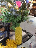 Yellow vase with foliage