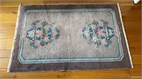 Antique Chinese carpet rug, with two vases of