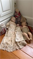 4 antique dolls, including one painted molded