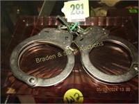 PAIR OF USED SMITH AND WESSON HAND CUFFS WITH