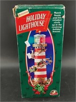 Holiday lighthouse with Santa's reindeer circling,