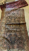 Two antique carpets, both with quite a bit of