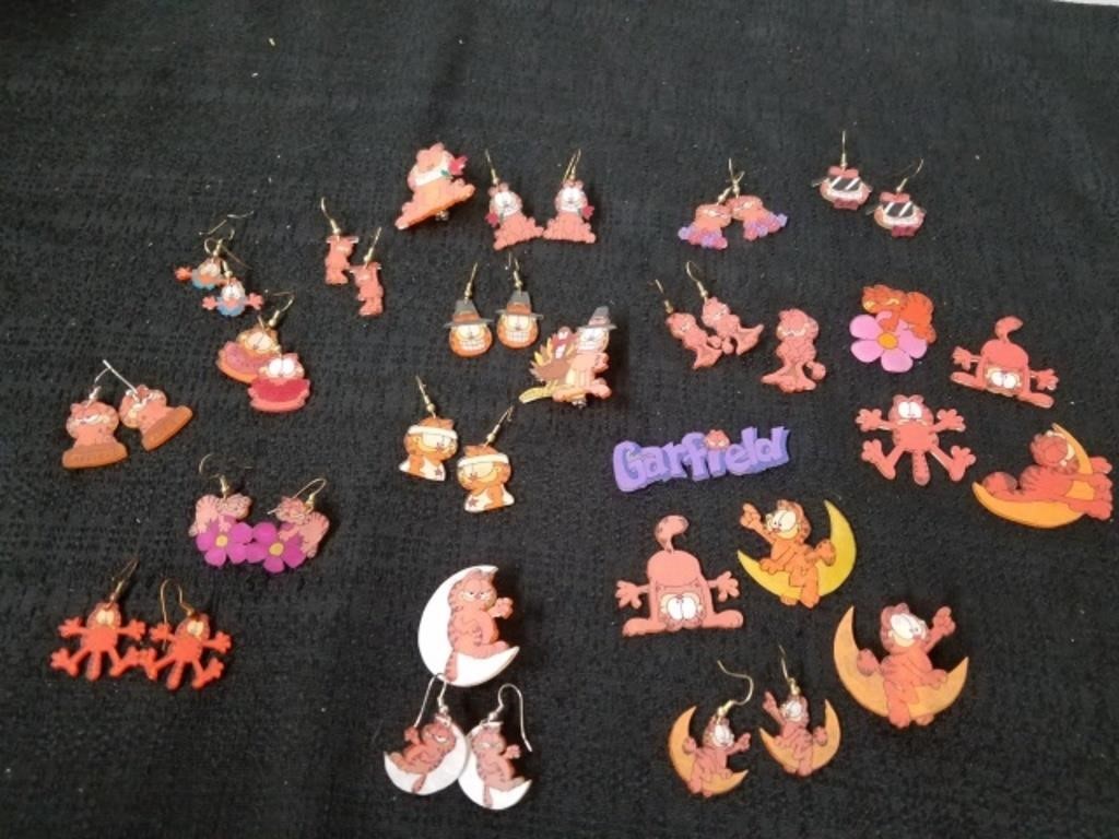 Large group of Garfield earrings and pins