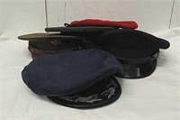 Group of military uniform hats