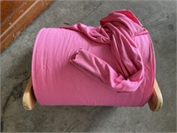 Large Spool of Pink Fabric.