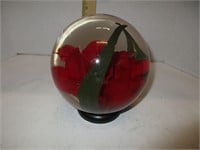 Glass globe with flower in water