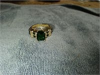Gold Toned Ring with Green Stones